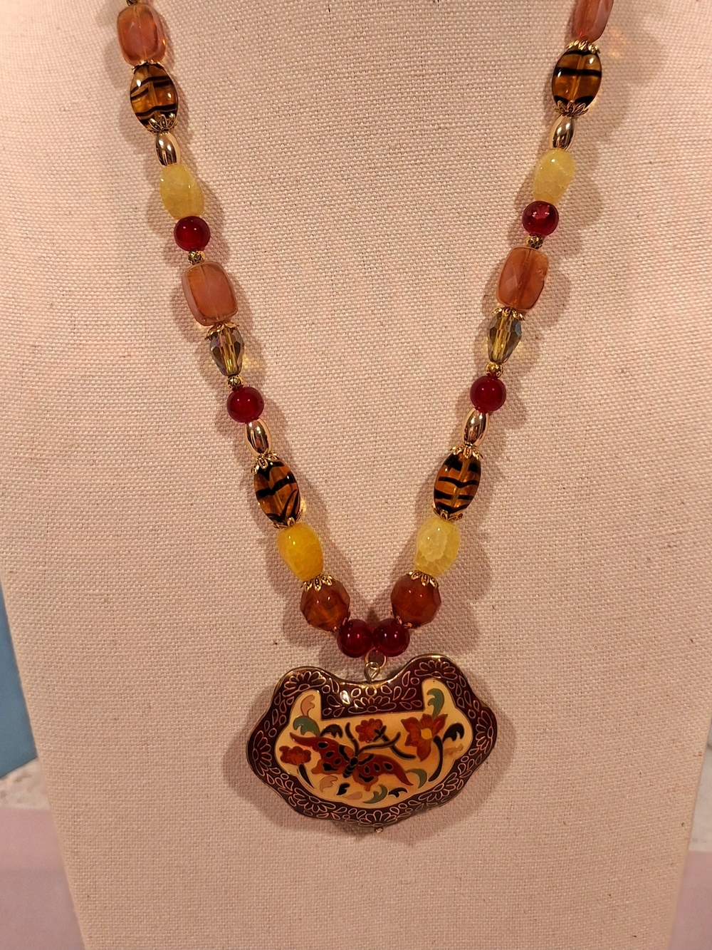 Artisan Crafted Beaded Necklace With Enamel Floral Butterfly Pendant